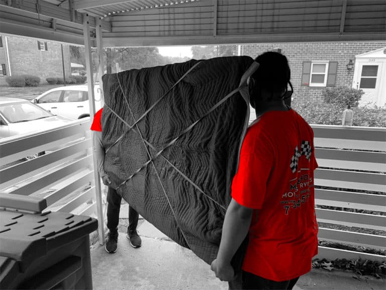 members of Marathon Moving Services carrying furniture
