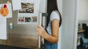 a featured image of how to move a refrigerator and appliances